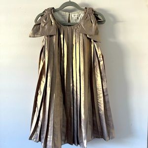 NWT,  Gorgeous metallic dress With bow detail on sleeve